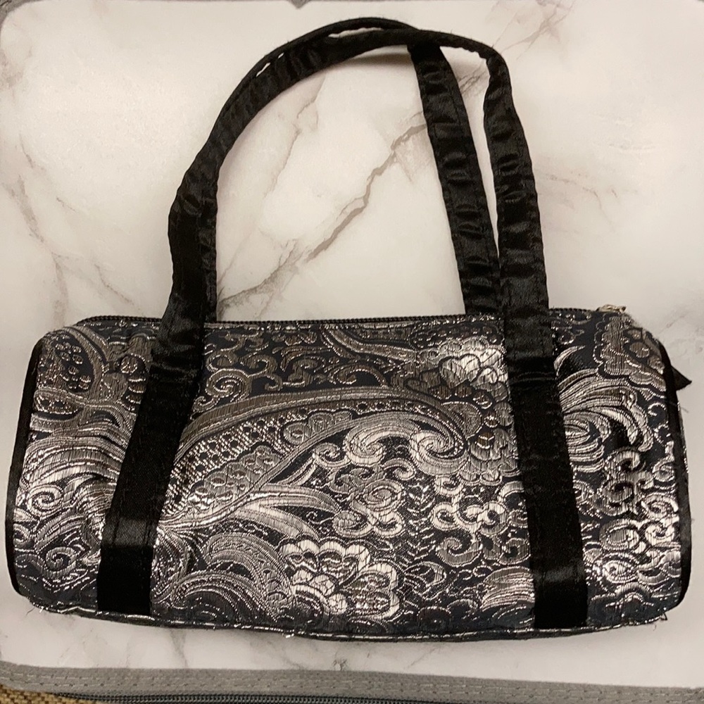 Silver and black clutch with zipper